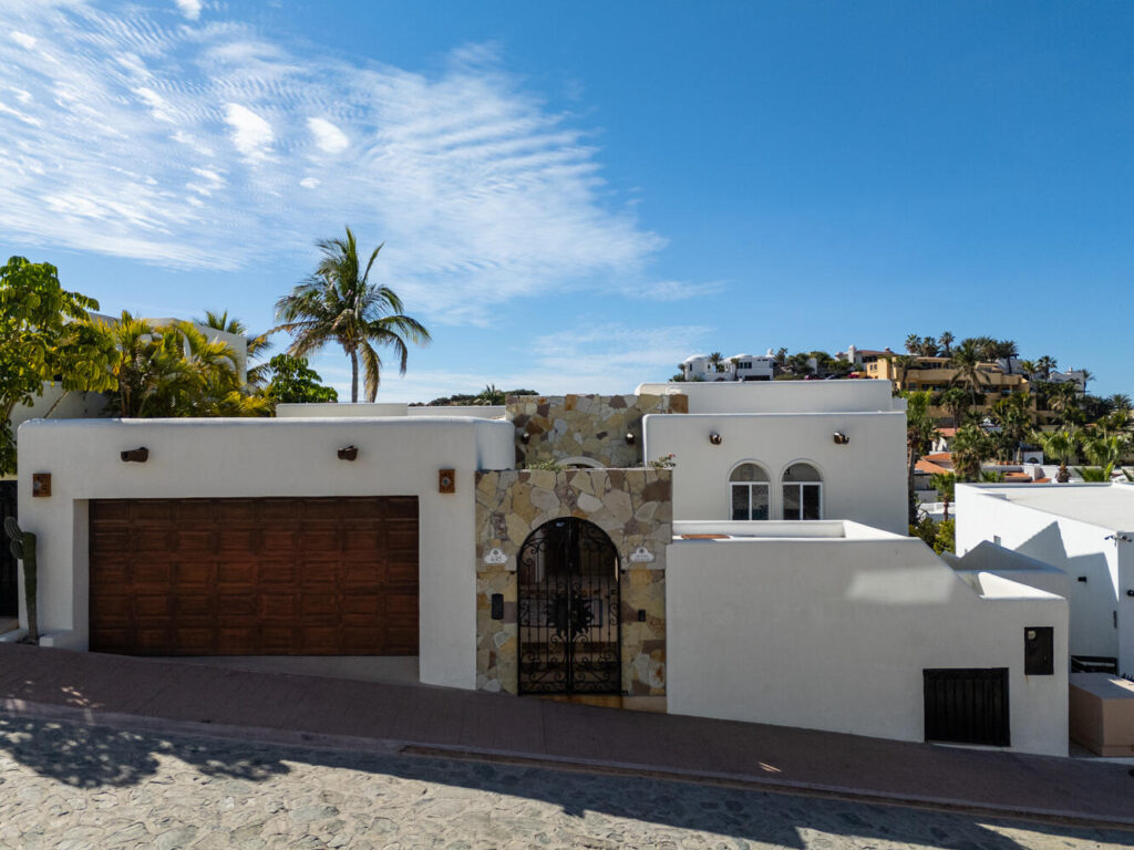 Los Cabos Blue Moon La Casa Bendecida, (The Blessed House), blends luxury, comfort, and convenience. This lovingly designed villa evokes a peaceful, refined ambiance, filled with the color and vibrancy of Mexico. Situated in the private community of El Pedregal, known as the ''The Beverly Hills of Cabo San Lucas,'' this gated community offers 24 hour security, cobblestone streets, lush landscaping, a beautiful private beach, and access to the exclusive owners only Mountain Club with a restaurant, gym, tennis courts, and pickleball courts.La Casa Bendecida is inspired by Mexico's rich traditions and craftsmanship, including Talavera tile, Palo de Arco wood, brick ceiling arches, and colorful folk art. A magnificent art collection enhances the villa's spaces. The layout maximizes indoor-outdoor living with numerous lovely areas to gather, including scenic outdoor terraces and portals. Windows frame postcard-worthy glimpses of the Sea of Cortez and the Pacific Ocean, with gorgeous sunrises and sunsets. The flowing open concept of this villa connects the spacious main living room, the well-equipped kitchen, and the dining room. Each of the four bedrooms offer unique themed design, decor and vibrant artistic touches paying homage to Mexican art, folklore, and local natural landscapes. There are 3 full bathrooms and a gorgeous talavera tiled outdoor shower. Outdoor living features a hot tub, swiimming pool, a Bar-height Fire Pit Dining Table, tables and chairs for relaxation around the pool, a dining table that seats 8 and several lovely portals with talavera tiled steps. There is even a swing for two to enjoy the breathtaking sunsets over the Pacific.La Casa Bendecida was transformed and remodeled and redesigned in 2021 by the current owners, who chose to return it to a home that reflected all that they love about Mexico. It is offered completely turnkey for a buyer seeking a fully furnished, income producing property. Everything needed to continue on with this proven rental performance home is provided for you. Overlooking the gorgeous park setting of the Valley of the Blue Moon, La Casa Bendecida is a seven minute walk to the beach. The recently updated Blue Moon Park common area offers exercise equipment and walking paths.Additional features include fiber optic WiFi, HD Smart TVs, mini split air conditioning, ceiling fans in every room, an Alexa sound system, a whole house water purification system, 2 sets of washer dryers, and a large full garage with lots of storage areas.La Casa Bendecida welcomes you with open arms as you make cherished memories here that will last a lifetime.Notes:This home has been completely renovated twice in the past 10 for sale