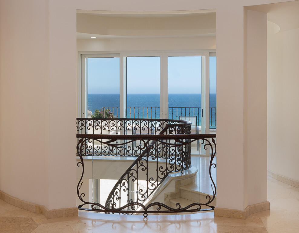 Los Cabos Pedregal Csl Villa Marcella sits on an exquisite piece of ocean front property in the exclusive community of Pedregal in Cabo San Lucas. This 6 bedroom 9 bathroom beach estate has a very private location with it's natural mountainside to it's left that make it perfect for entertaining large beach parties, family gatherings, it has even been known to host quite a few a weddings. The beach estate consists of outdoor fire pit, Olympic size swimming pool, jacuzzi, outdoor cooking area, indoor game and bar room accessible from the beach. Enjoy the long beach walks and beautiful Pacific sunrises and sunsets from this beach home. Excellent INVESTMENT property or private home on the beach. for sale